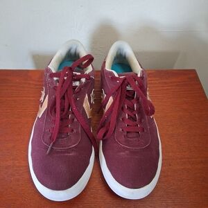 The Converse All Star Point Star Low Top Burgundy Sneakers with Gold Star Logo
